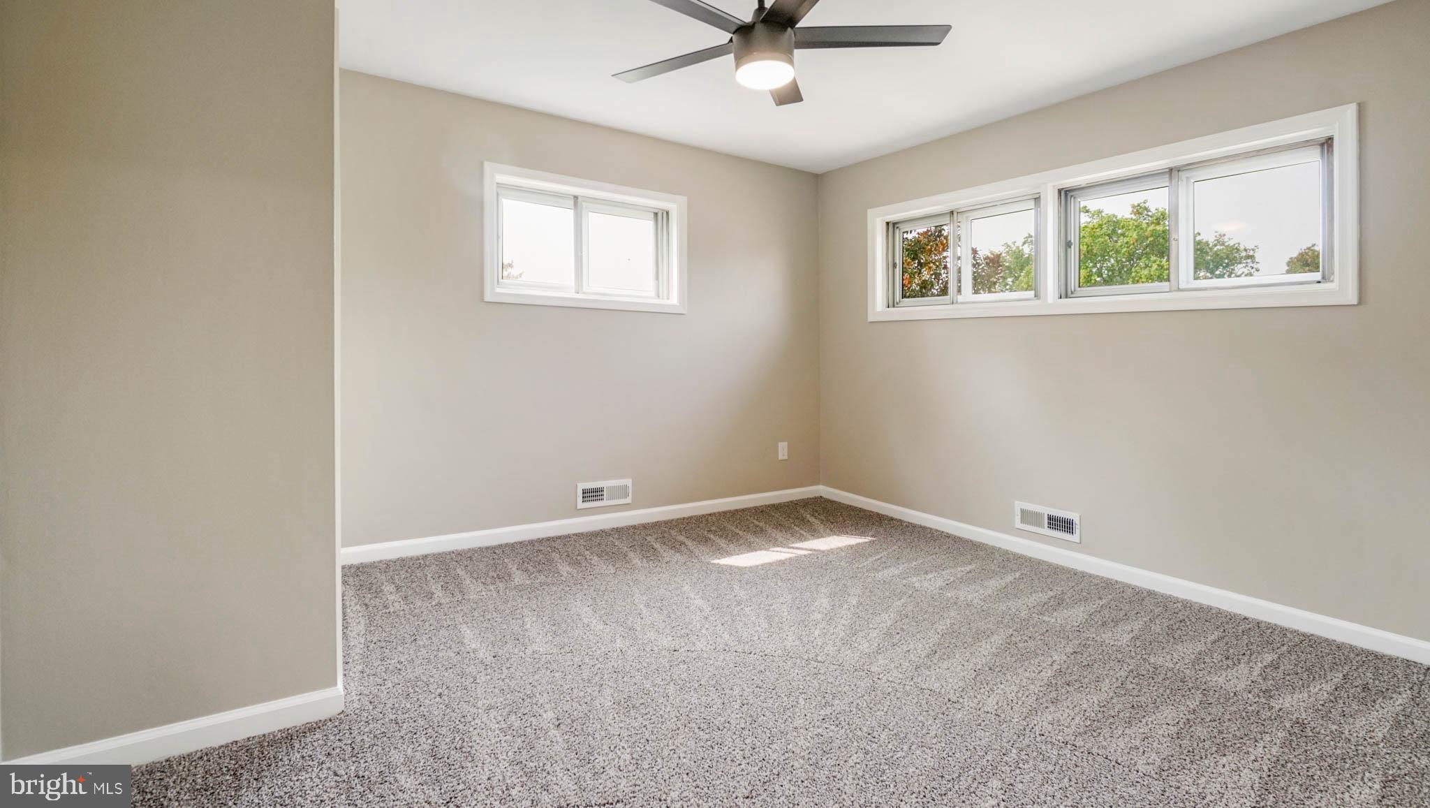 5932 Charnwood Road Baltimore, MD 21228 - Photo 11 of 21 a view of an empty room with a window