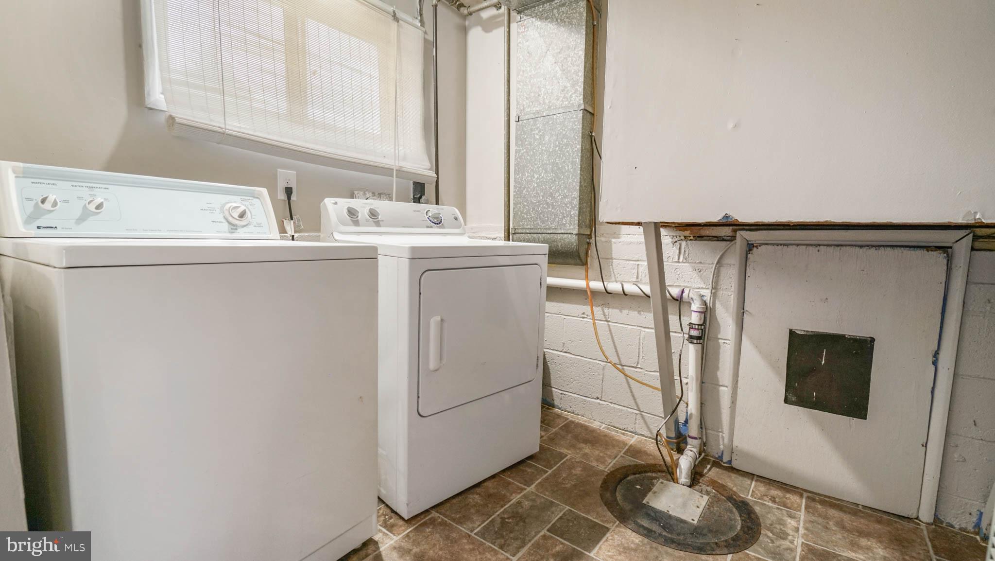 5932 Charnwood Road Baltimore, MD 21228 - Photo 15 of 21 a utility room with dryer and washer