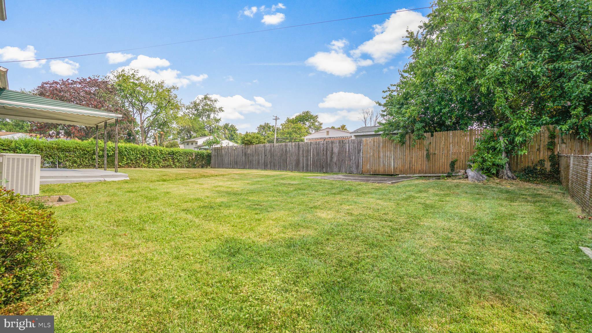 5932 Charnwood Road Baltimore, MD 21228 - Photo 19 of 21 a view of backyard with swimming pool and outdoor seating