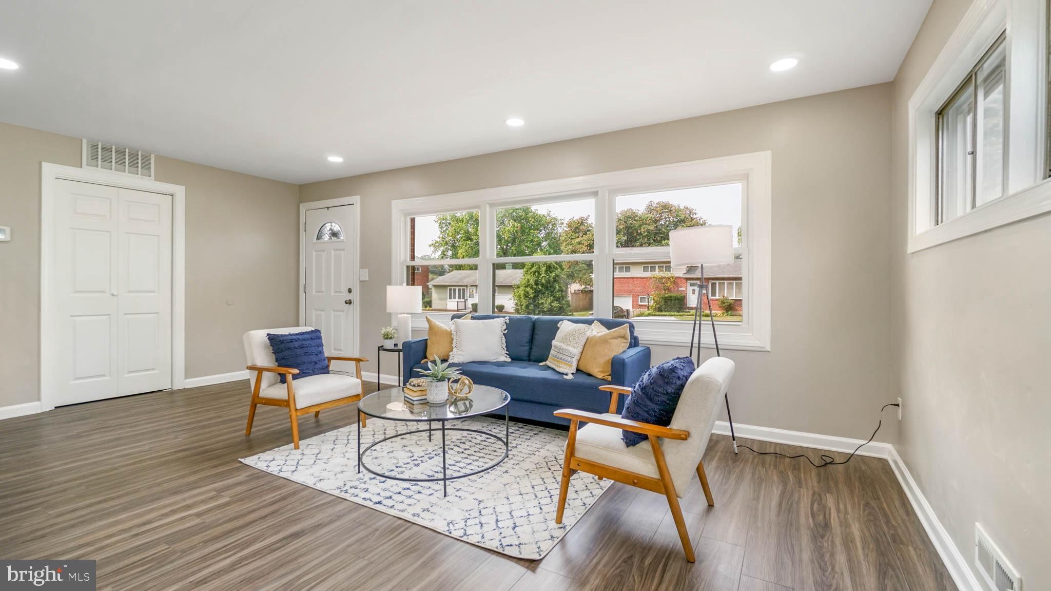 5932 Charnwood Road Baltimore, MD 21228 - Photo 5 of 21 a living room with furniture and a wooden floor