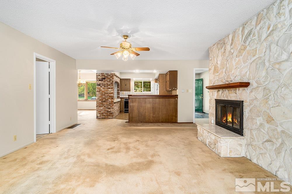2120 Dant Boulevard Reno, NV 89509 - Photo 7 of 33 a view of a livingroom with a fireplace and a window