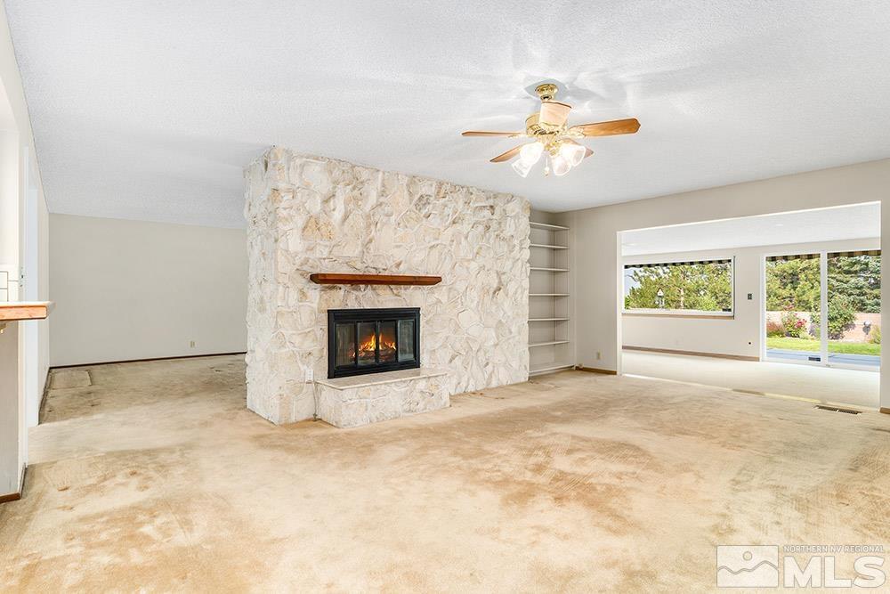 2120 Dant Boulevard Reno, NV 89509 - Photo 9 of 33 a view of an empty room with a fireplace and a window