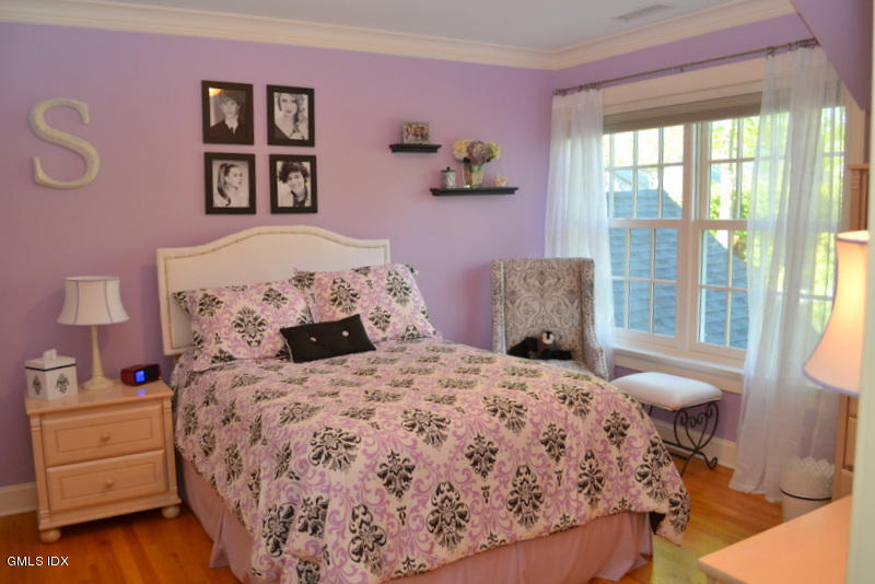 15 Palmer Terrace Riverside, CT 06878 - Photo 13 of 22 a bedroom with a bed and a window