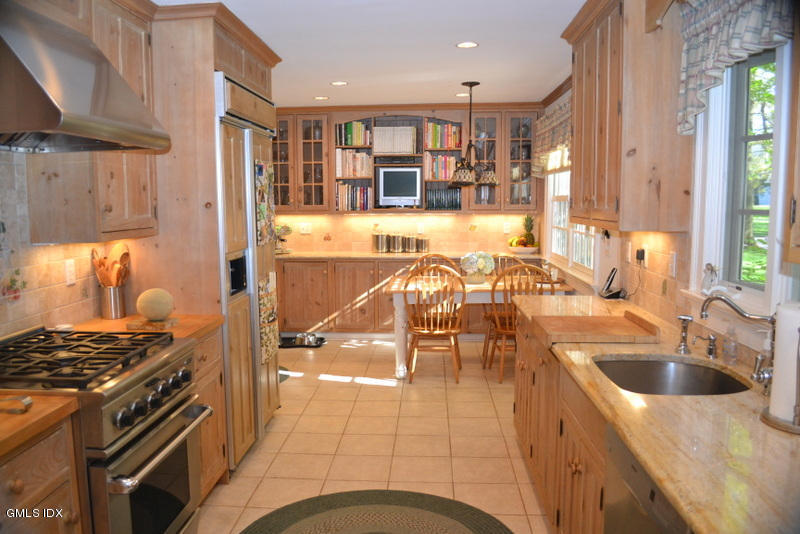 15 Palmer Terrace Riverside, CT 06878 - Photo 5 of 22 a kitchen with a sink and a stove top oven