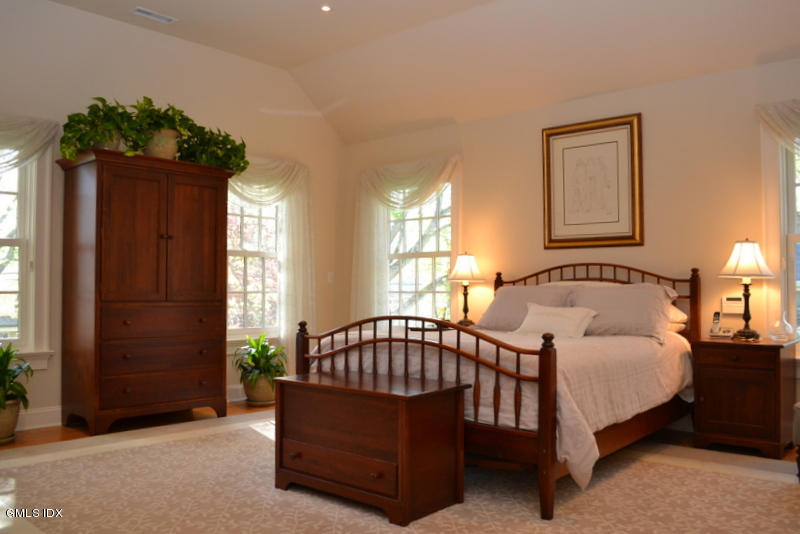 15 Palmer Terrace Riverside, CT 06878 - Photo 8 of 22 a spacious bedroom with a bed and a window