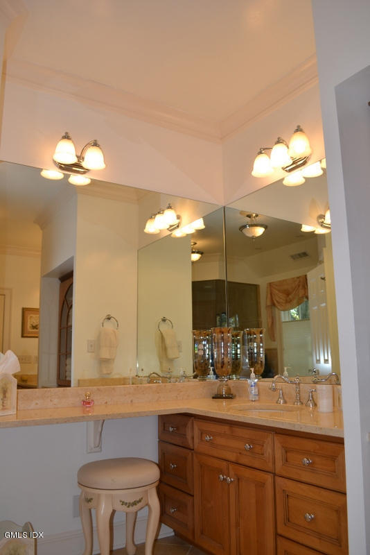 15 Palmer Terrace Riverside, CT 06878 - Photo 10 of 22 a bathroom with a granite countertop sink a toilet and a large mirror