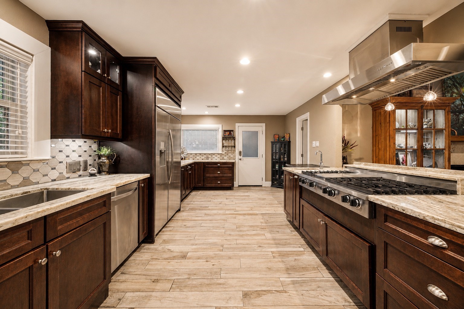 5 Tree Frog Drive Houston, TX 77074 - Photo 6 of 25 a large kitchen with stainless steel appliances granite countertop a stove and a sink