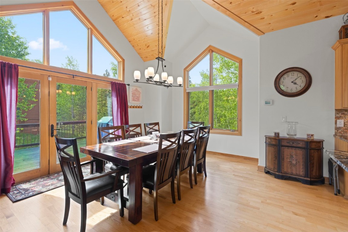 736 Wild Rose Road Silverthorne, CO 80498 - Photo 13 of 49 a view of a dining room with furniture window and wooden floor