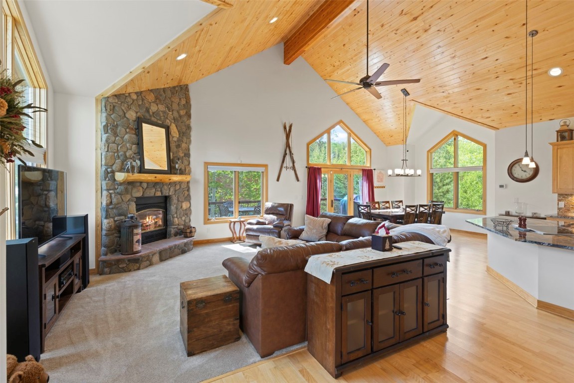 736 Wild Rose Road Silverthorne, CO 80498 - Photo 2 of 49 a living room with fireplace furniture and a large window