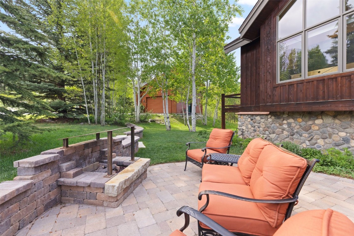 736 Wild Rose Road Silverthorne, CO 80498 - Photo 48 of 49 a backyard of a house with outdoor seating