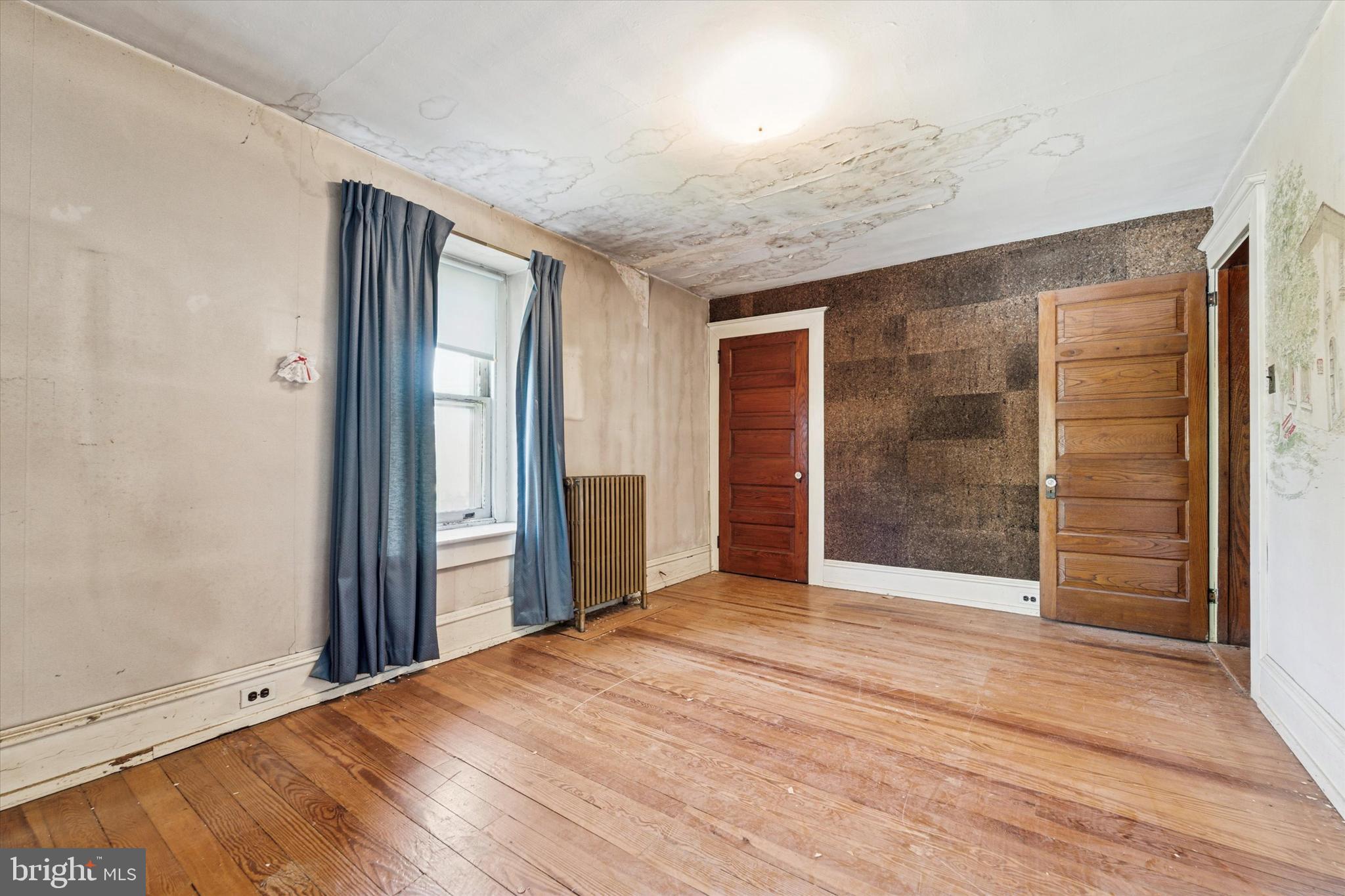 2546 North Broad Street Colmar, PA 19446 - Photo 13 of 25 an empty room with wooden floor and windows