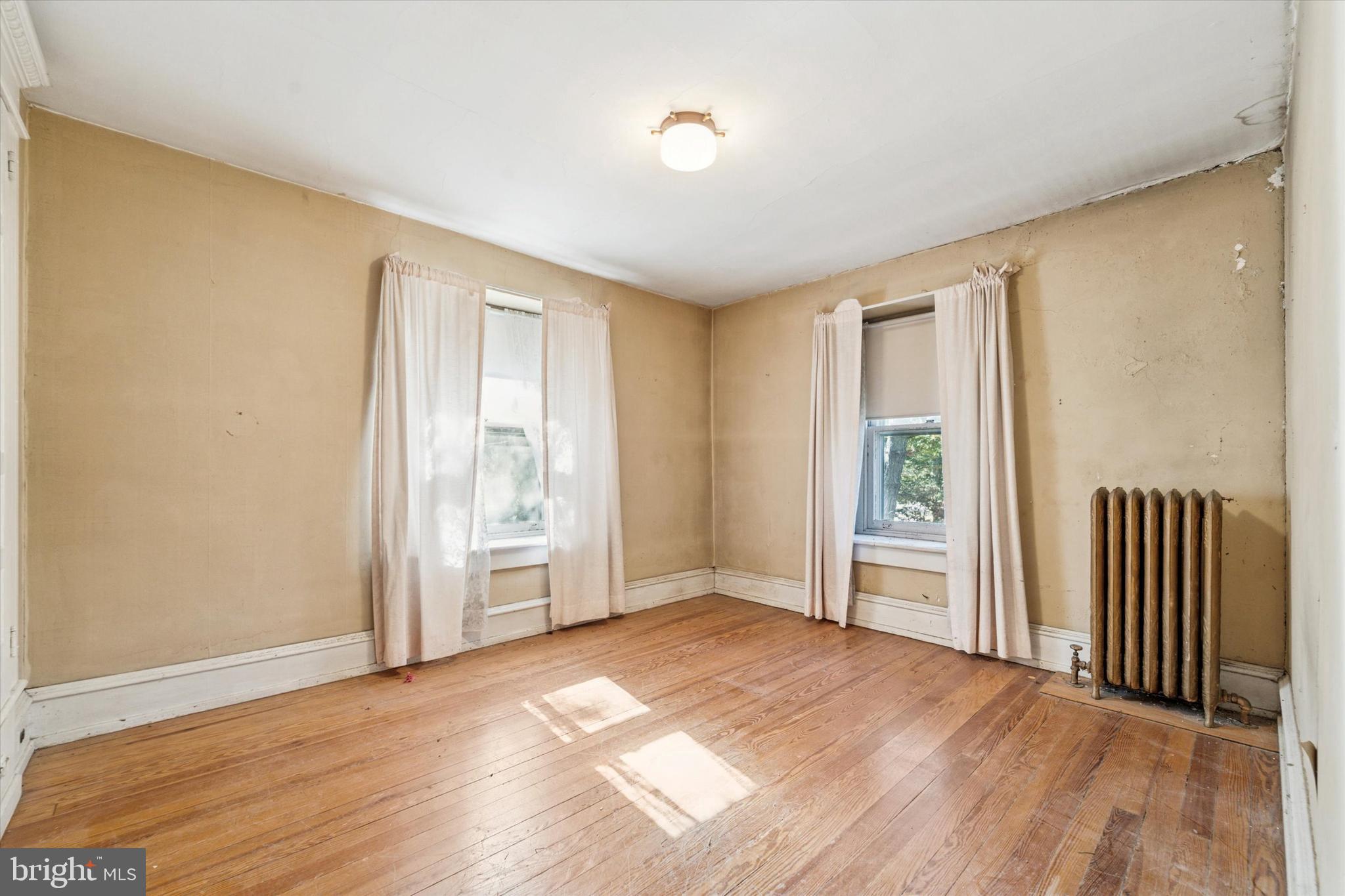 2546 North Broad Street Colmar, PA 19446 - Photo 16 of 25 an empty room with wooden floor and windows
