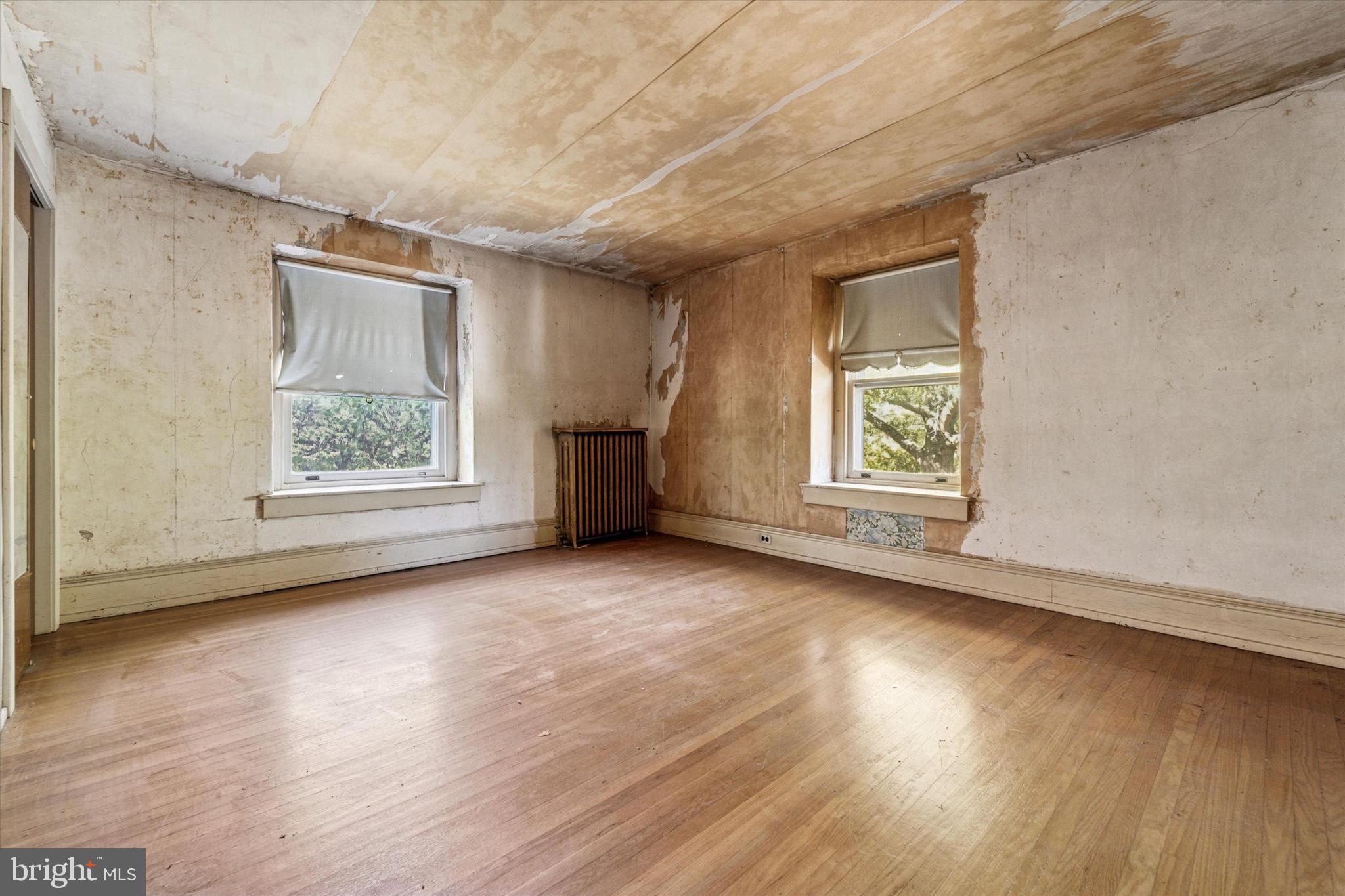 2546 North Broad Street Colmar, PA 19446 - Photo 19 of 25 an empty room with wooden floor and windows