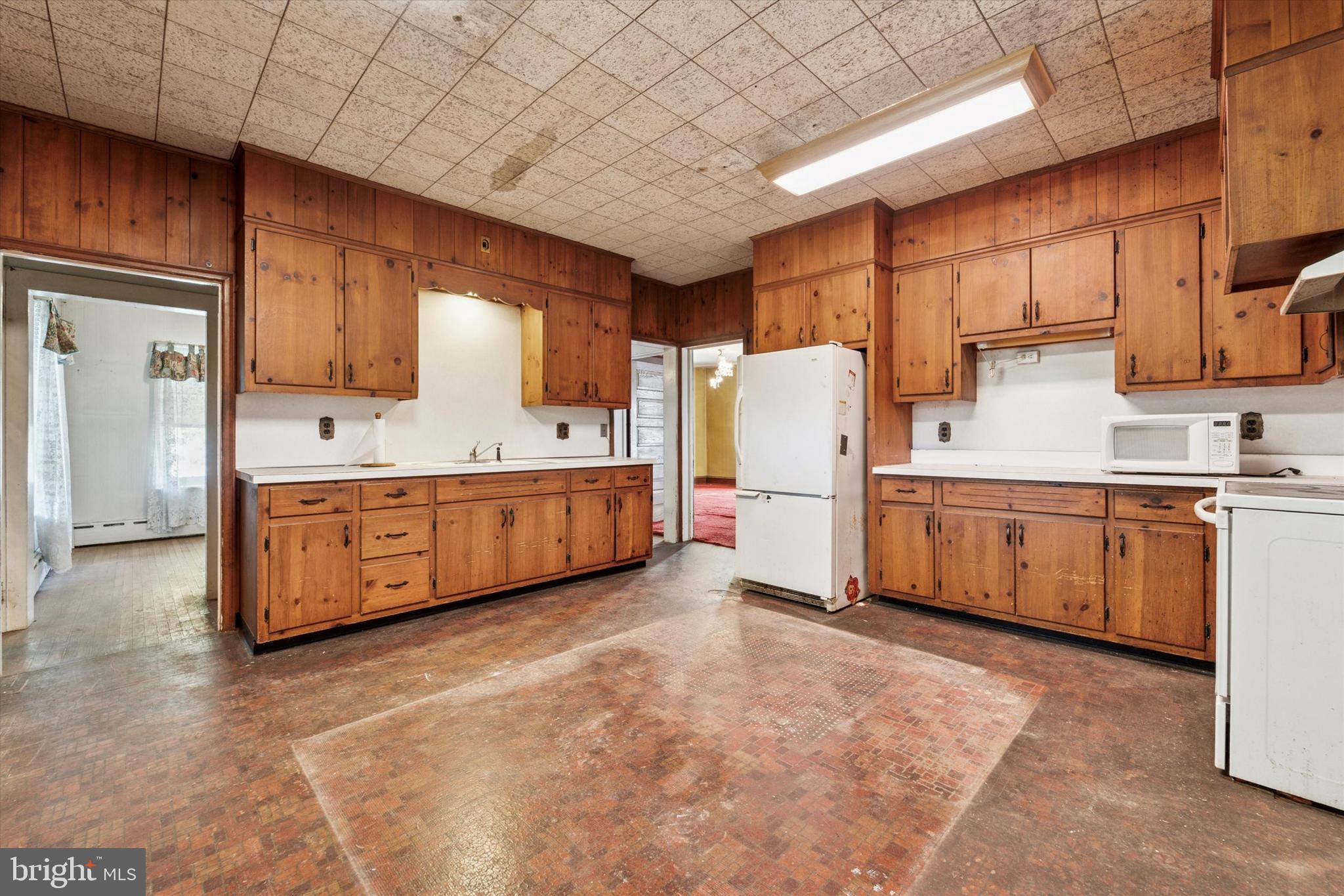 2546 North Broad Street Colmar, PA 19446 - Photo 6 of 25 a kitchen with refrigerator and cabinets