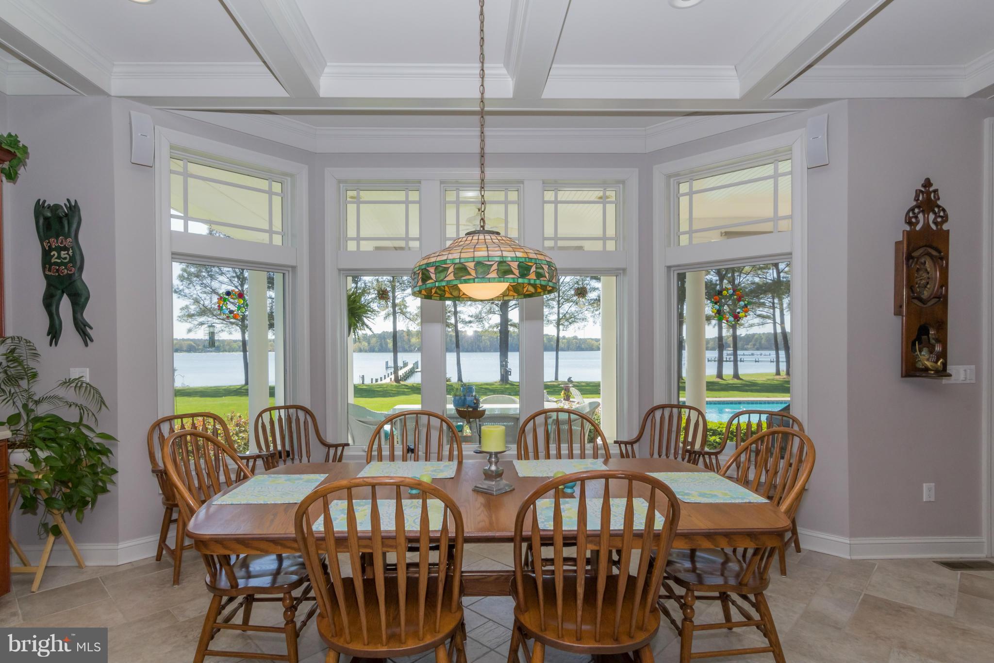 8092 Church Neck Road St. Michaels, MD 21663 - Photo 11 of 27 a view of a dining room with furniture window and outside view
