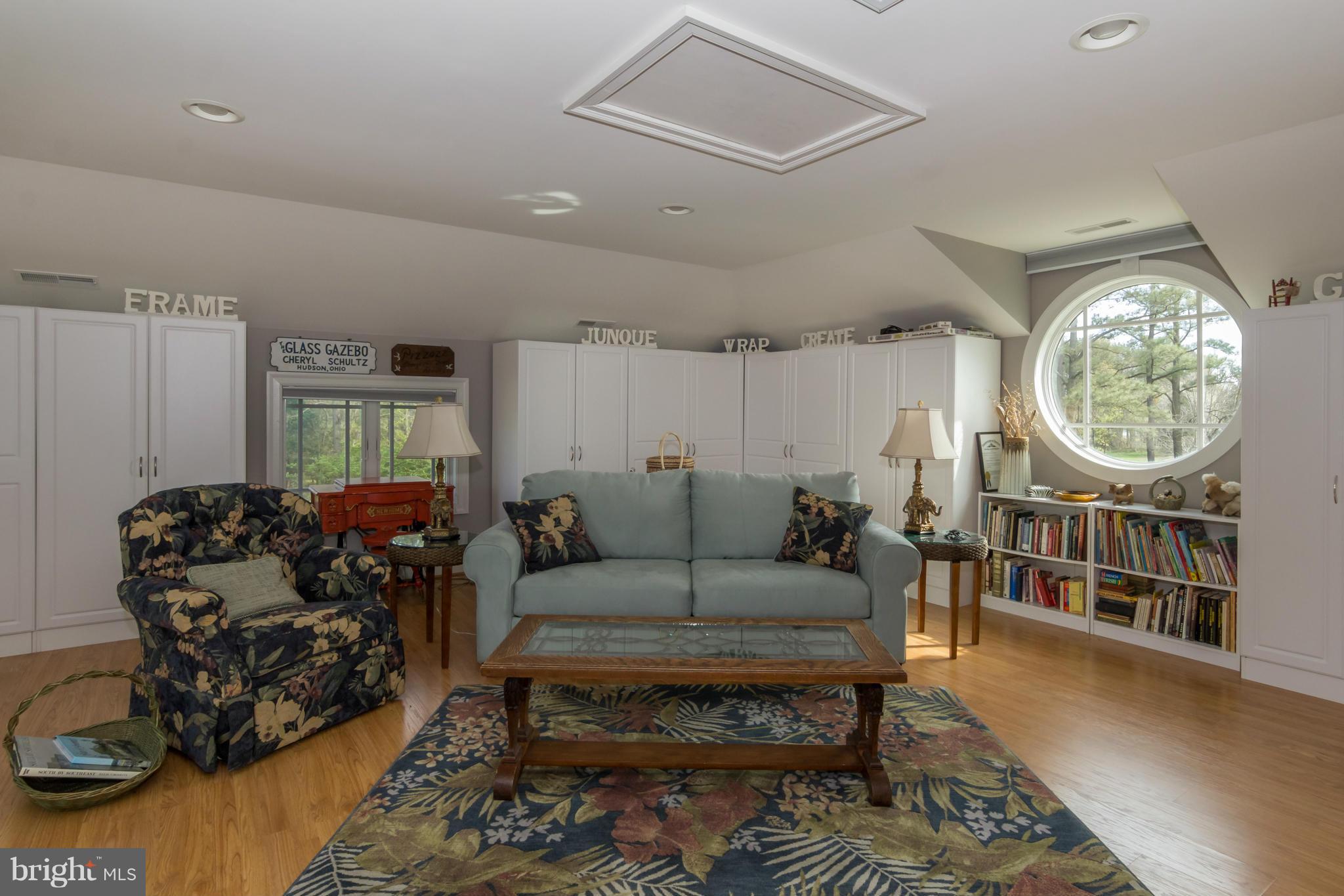 8092 Church Neck Road St. Michaels, MD 21663 - Photo 16 of 27 a living room with furniture a rug and a window
