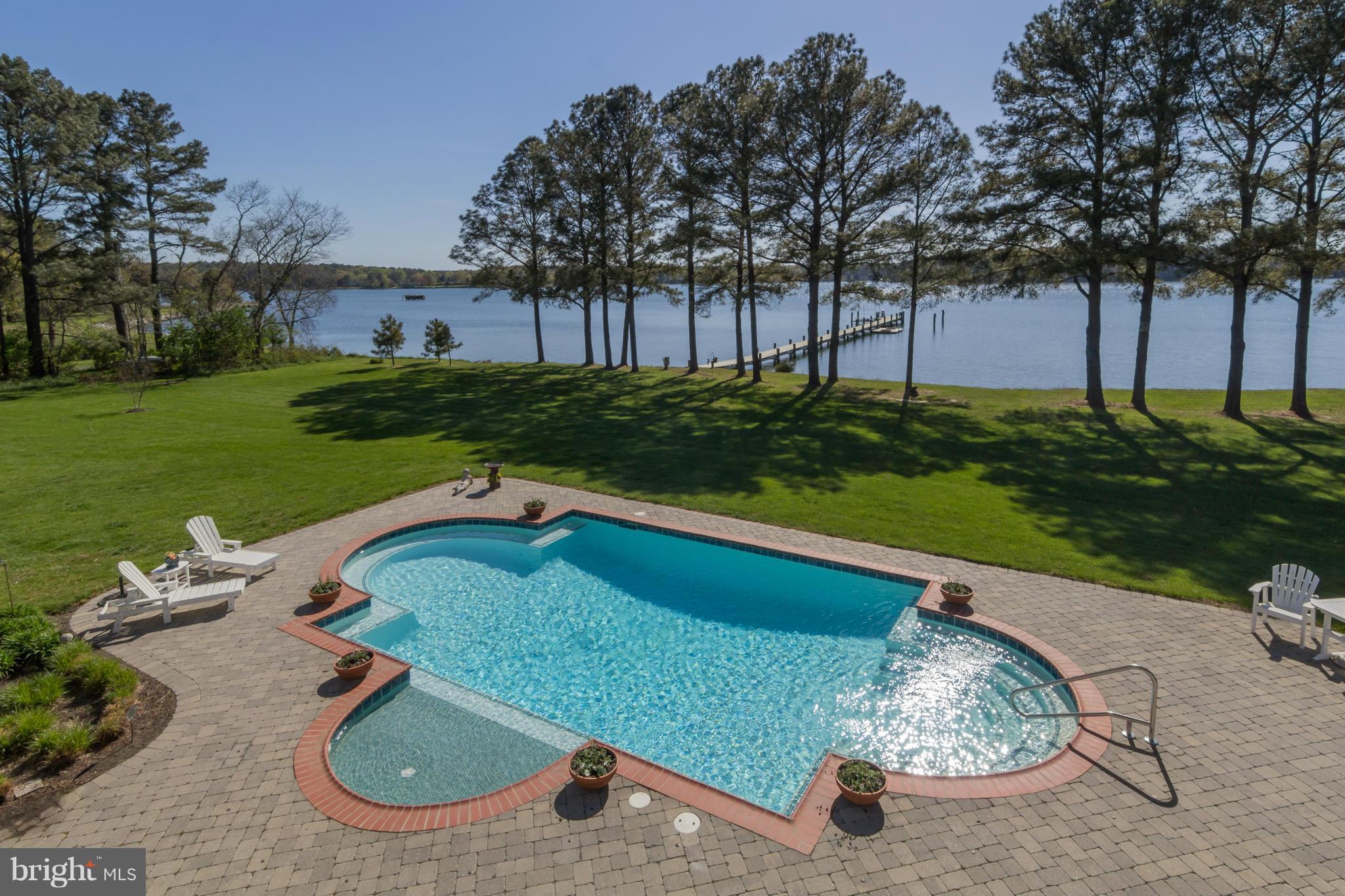 8092 Church Neck Road St. Michaels, MD 21663 - Photo 20 of 27 a view of a backyard with sitting area