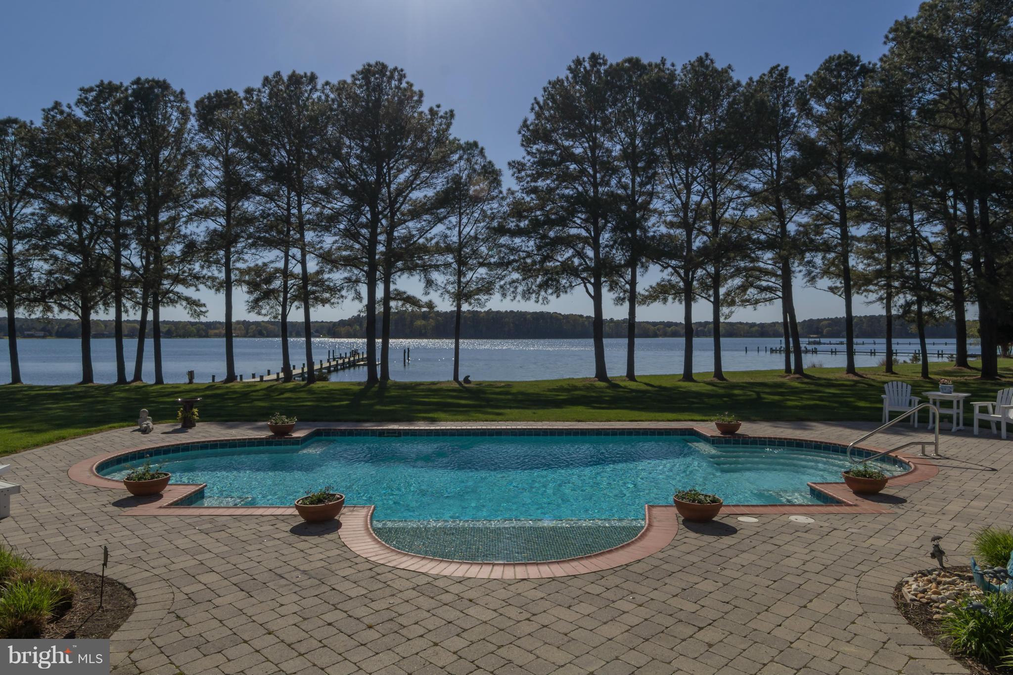 8092 Church Neck Road St. Michaels, MD 21663 - Photo 22 of 27 a view of a swimming pool with a yard