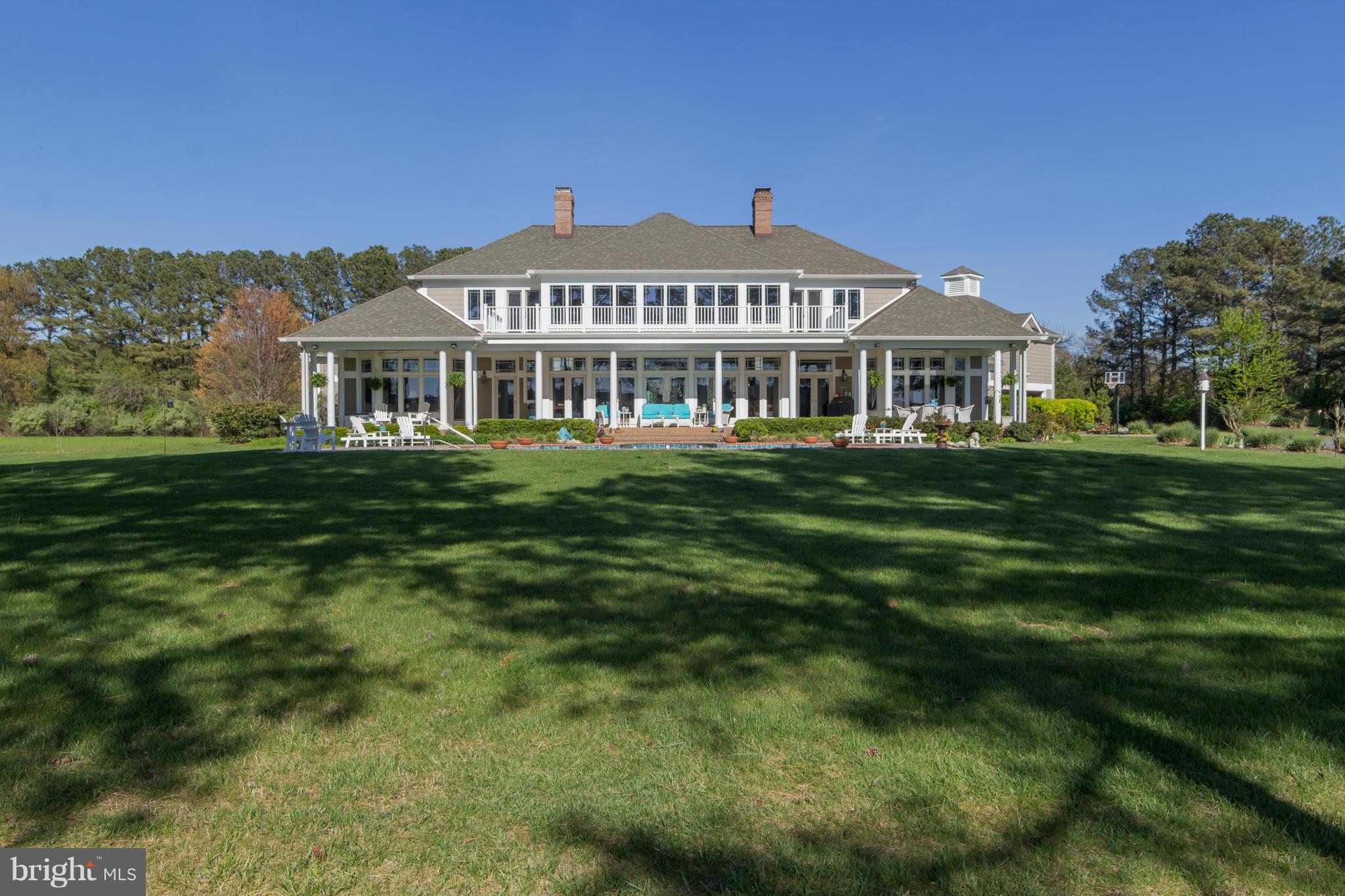 8092 Church Neck Road St. Michaels, MD 21663 - Photo 23 of 27 a front view of a house with a garden