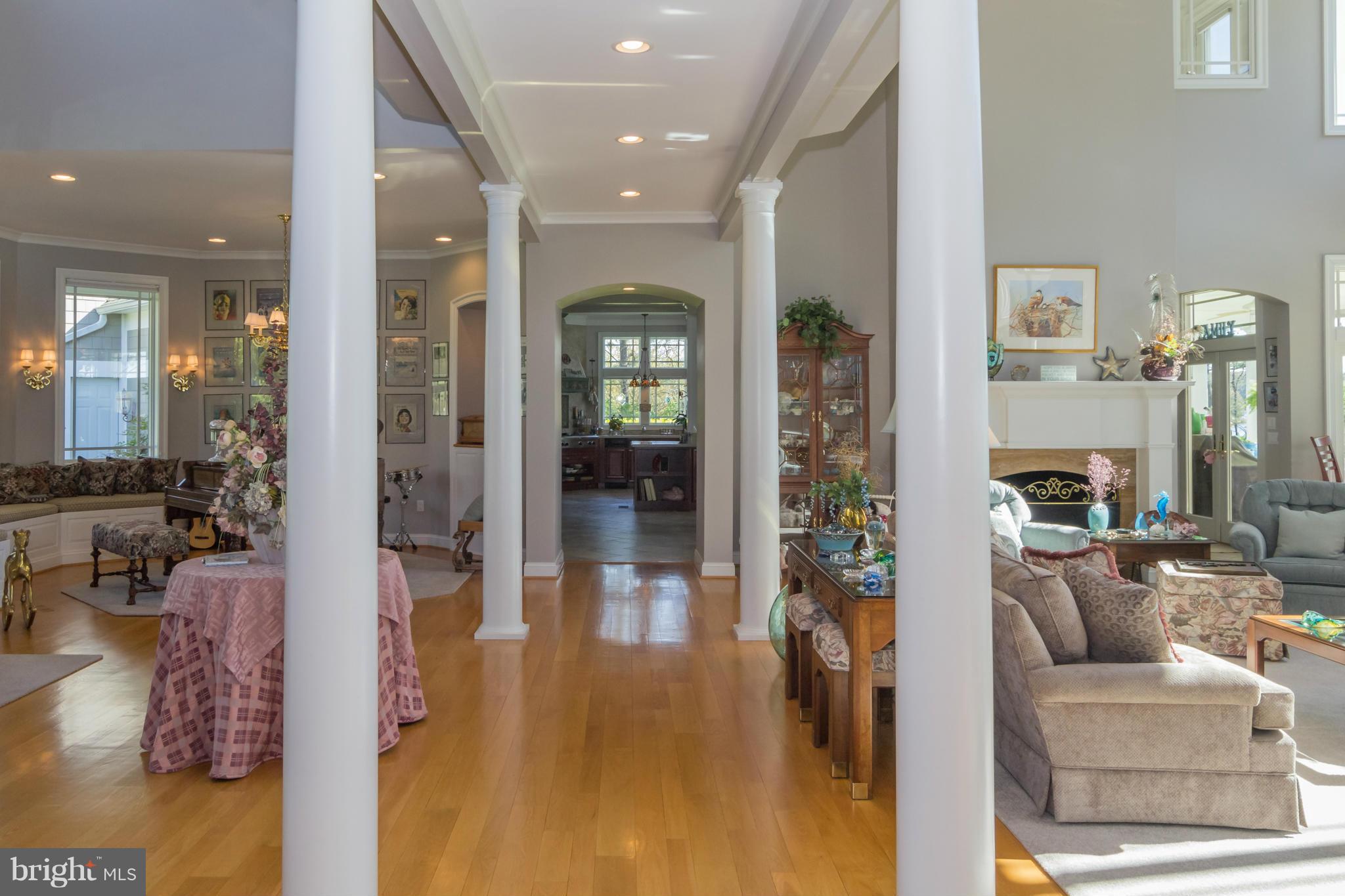 8092 Church Neck Road St. Michaels, MD 21663 - Photo 5 of 27 a living room with furniture and a fireplace