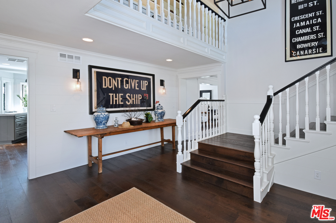 560 Cold Canyon Road Calabasas, CA 91302 - Photo 13 of 38 a living room with stairs and a stairs