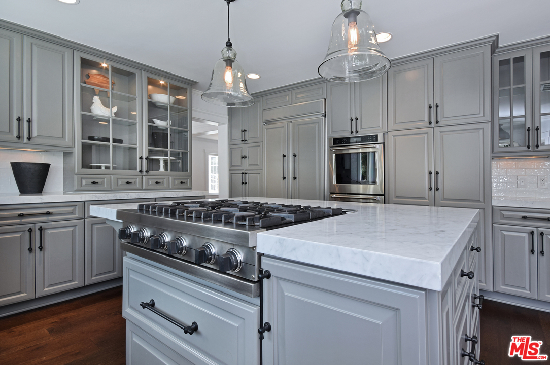 560 Cold Canyon Road Calabasas, CA 91302 - Photo 16 of 38 a kitchen with a stove and a refrigerator