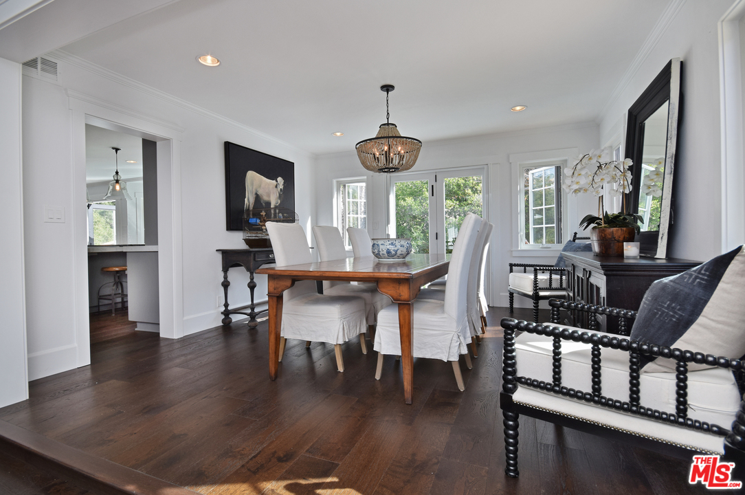560 Cold Canyon Road Calabasas, CA 91302 - Photo 18 of 38 a view of a dining room with furniture window and wooden floor
