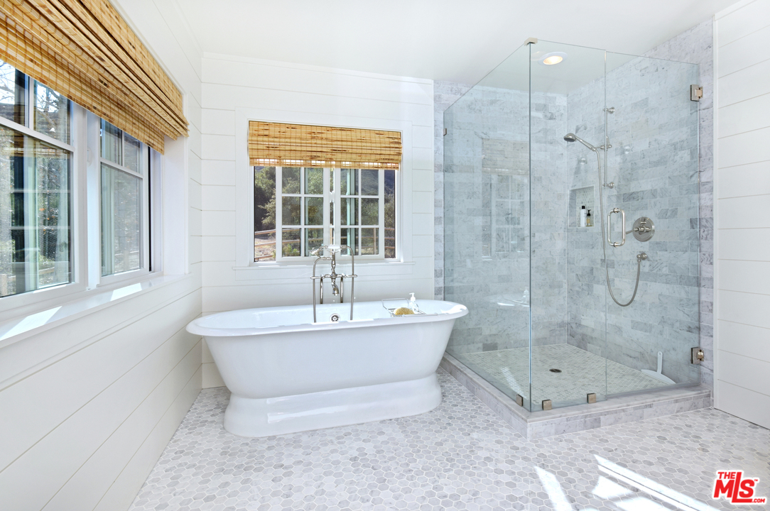 560 Cold Canyon Road Calabasas, CA 91302 - Photo 24 of 38 a bathroom with a bathtub and shower