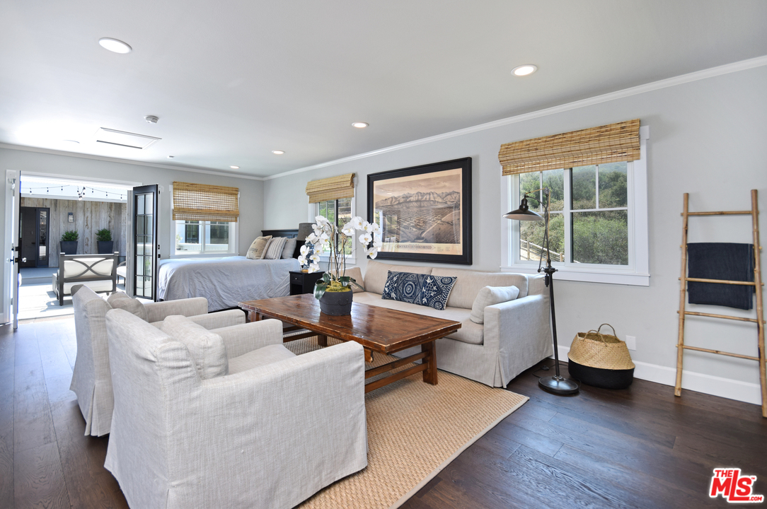 560 Cold Canyon Road Calabasas, CA 91302 - Photo 30 of 38 a living room with furniture and wooden floor