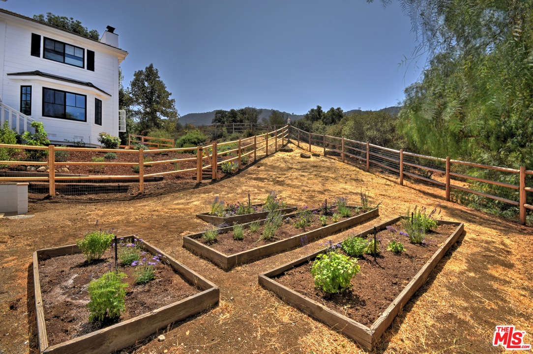 560 Cold Canyon Road Calabasas, CA 91302 - Photo 34 of 38 a view of a swimming pool with a patio