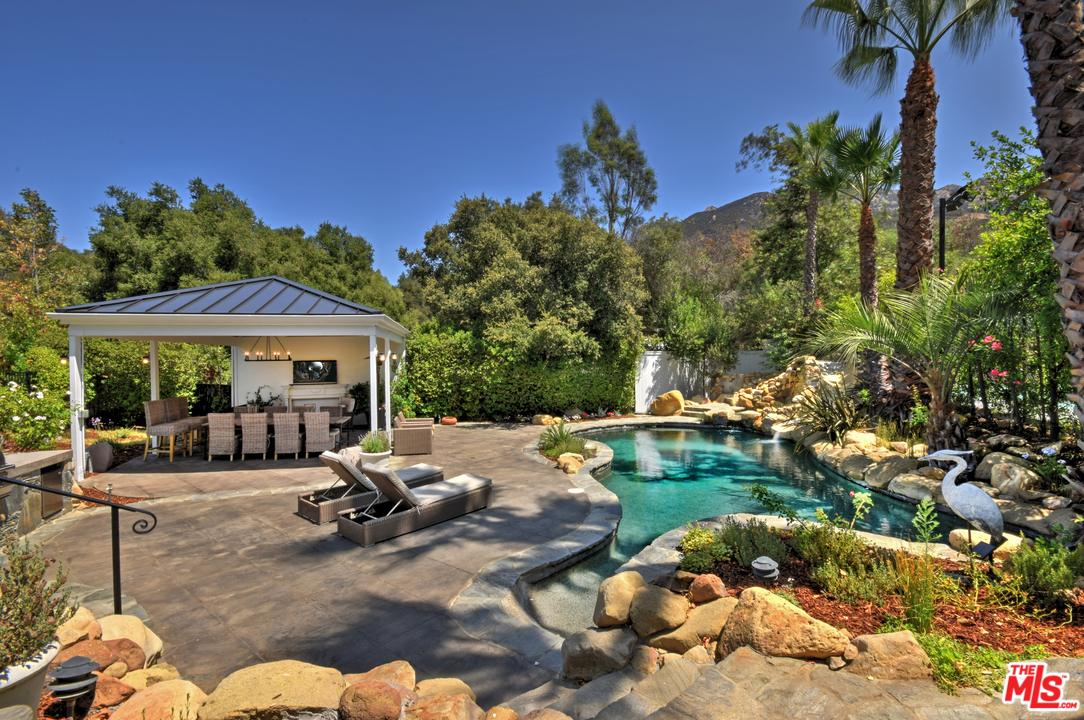 560 Cold Canyon Road Calabasas, CA 91302 - Photo 5 of 38 a view of a backyard with a patio