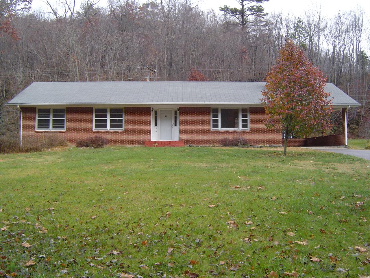 410 Brake Road Elliston, VA 24087 - Photo 1 of 14 a house that has a backyard