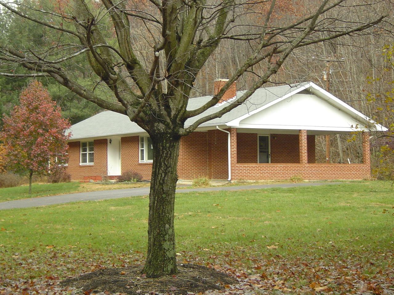 410 Brake Road Elliston, VA 24087 - Photo 2 of 14 a front view of a house with a yard