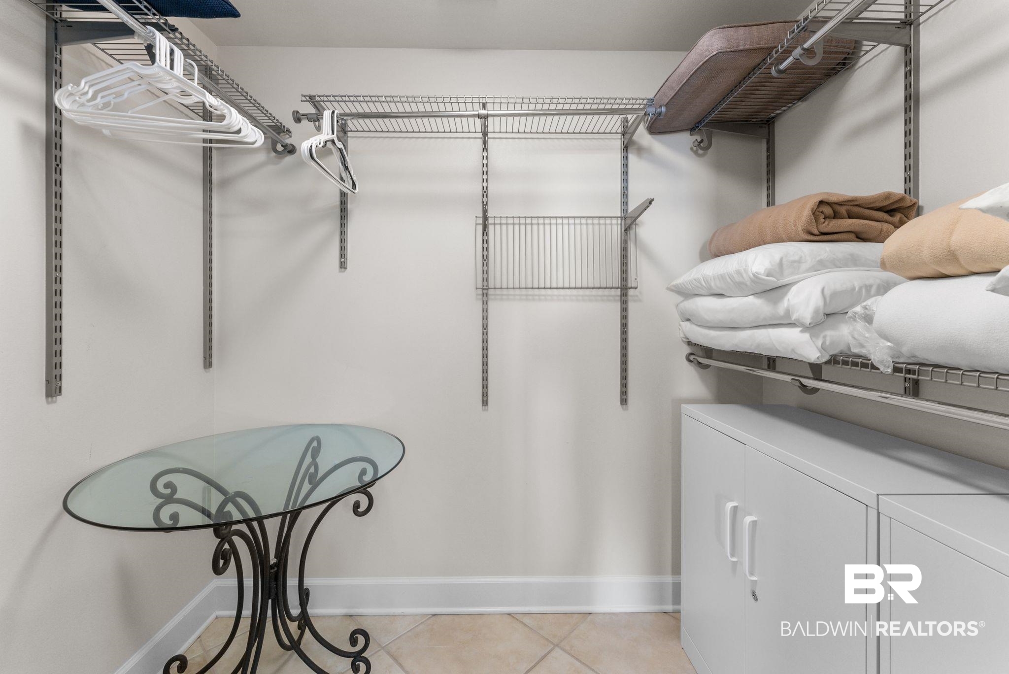 27580 Canal Road, Unit 1233 Orange Beach, AL 36561 - Photo 52 of 79 Walk in closet with light tile patterned floors