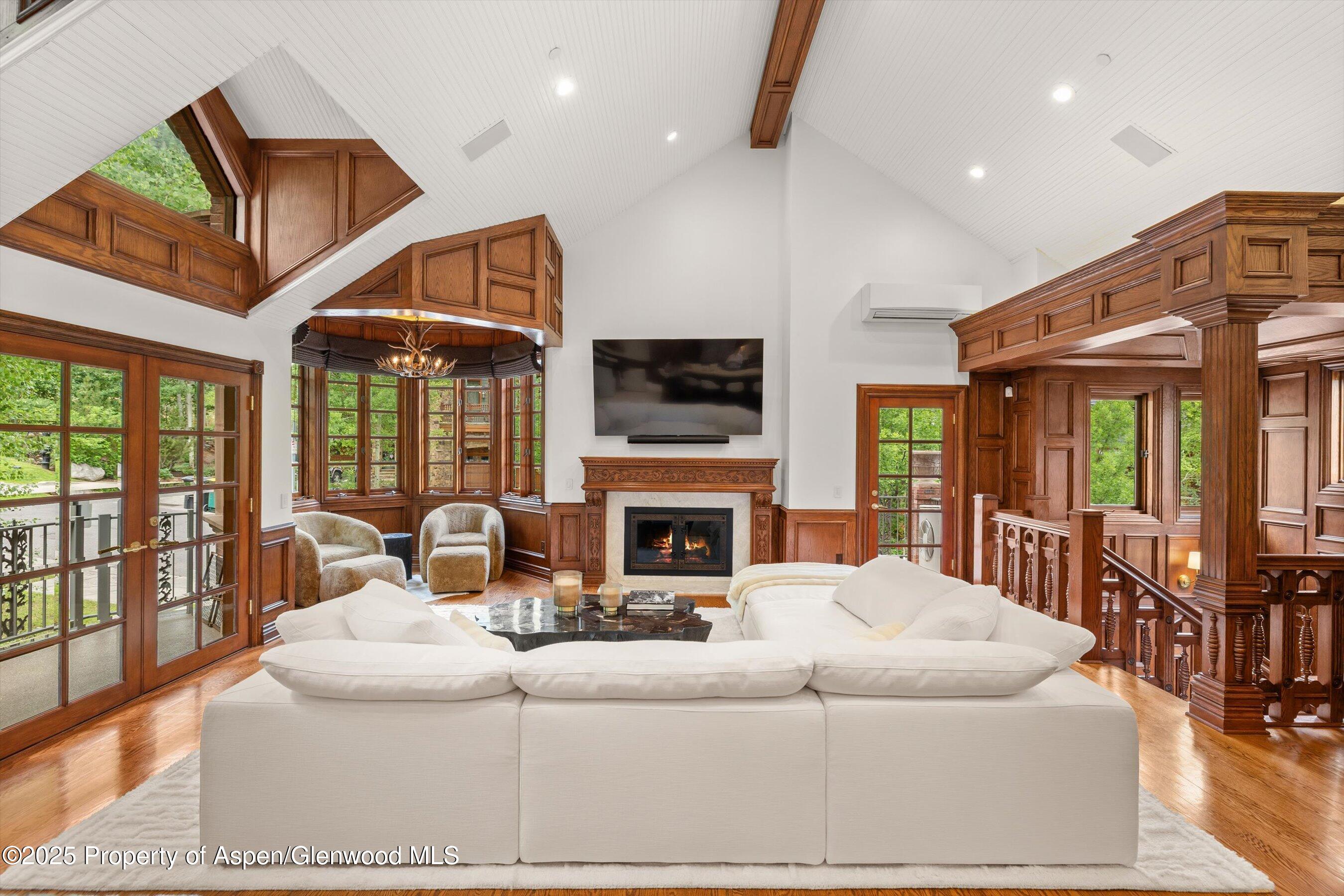 918 South Mill Street, Unit A Aspen, CO 81611 - Photo 1 of 34 a living room with fireplace furniture and a large window