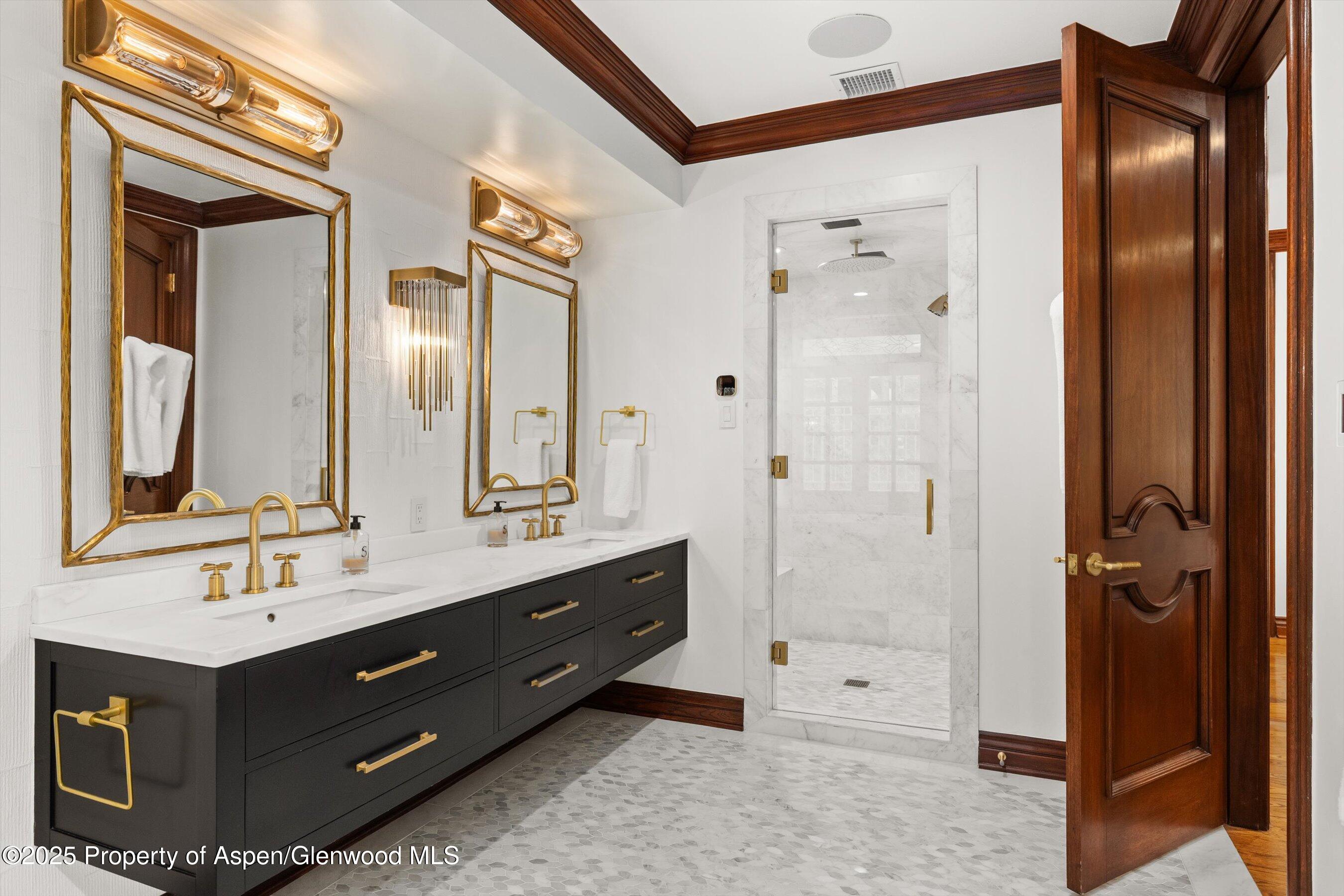 918 South Mill Street, Unit A Aspen, CO 81611 - Photo 16 of 34 a bathroom with a double vanity sink mirror and shower