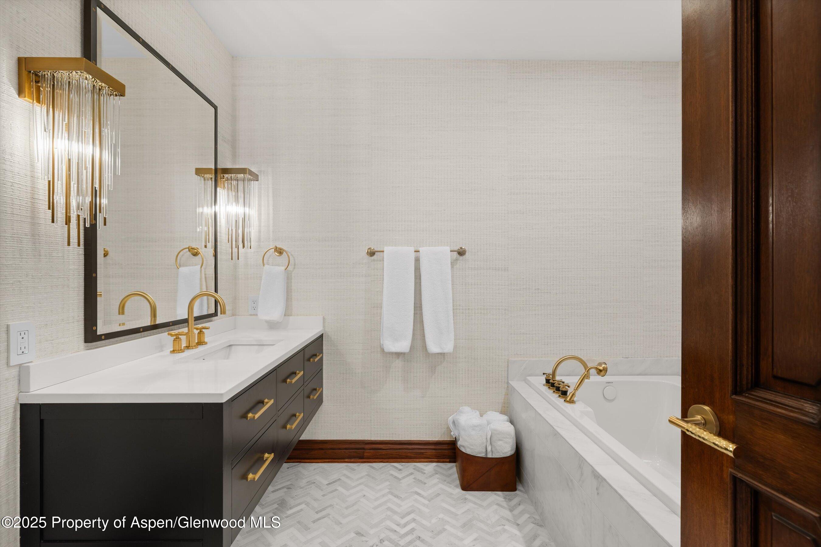 918 South Mill Street, Unit A Aspen, CO 81611 - Photo 26 of 34 a bathroom with a sink and a mirror