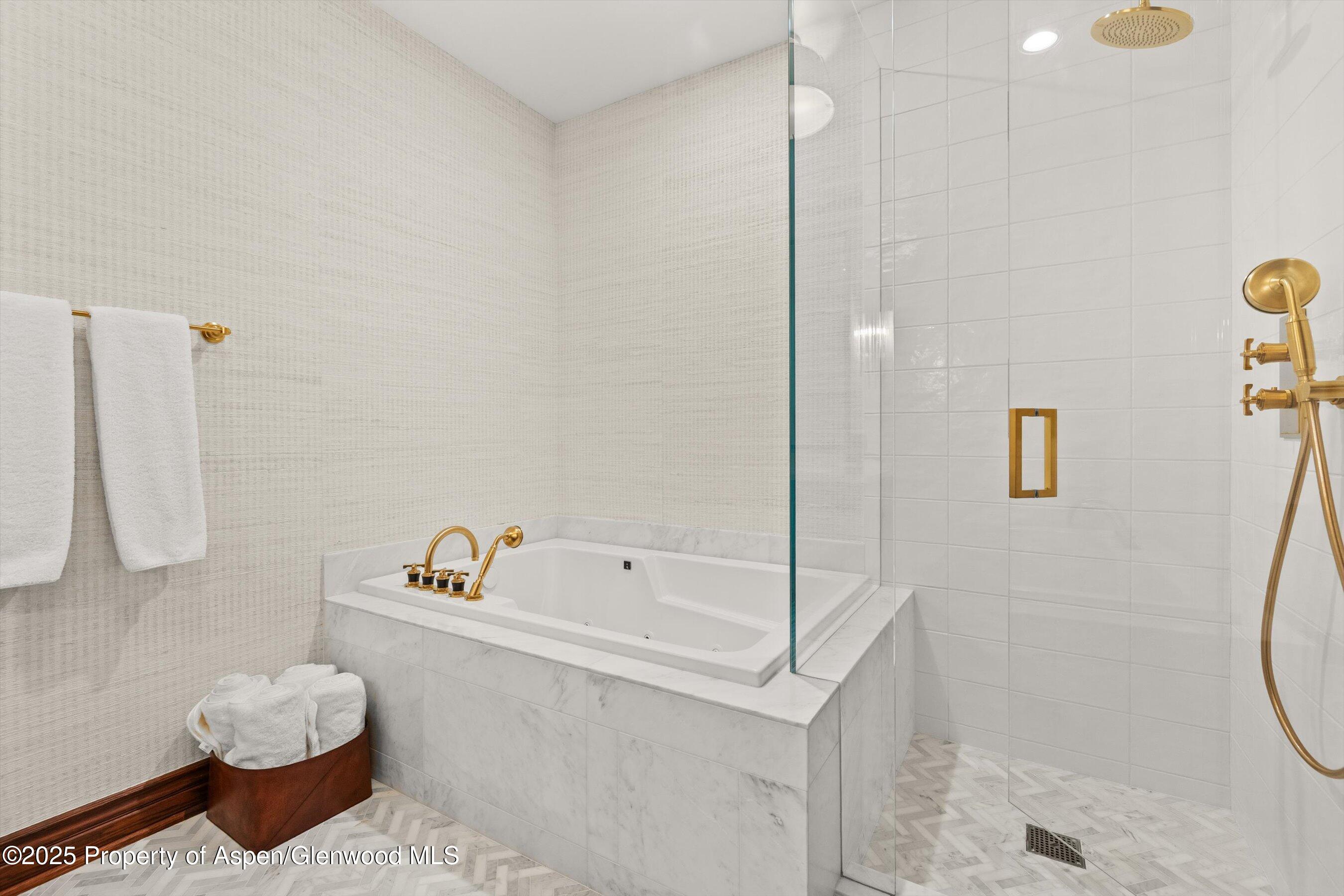 918 South Mill Street, Unit A Aspen, CO 81611 - Photo 27 of 34 a bathroom with a bathtub sink and toilet