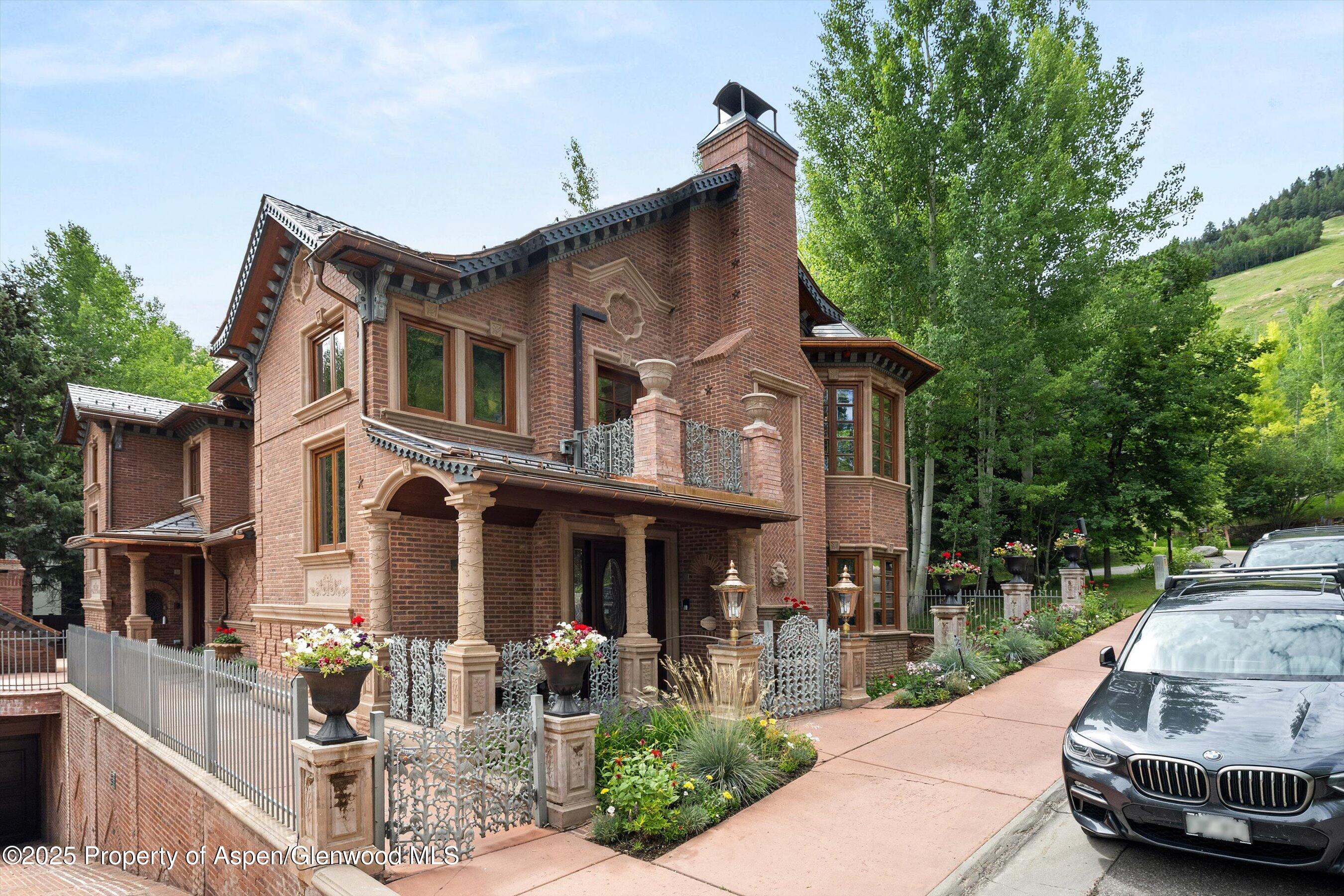 918 South Mill Street, Unit A Aspen, CO 81611 - Photo 32 of 34 a front view of a house with sitting area and garden