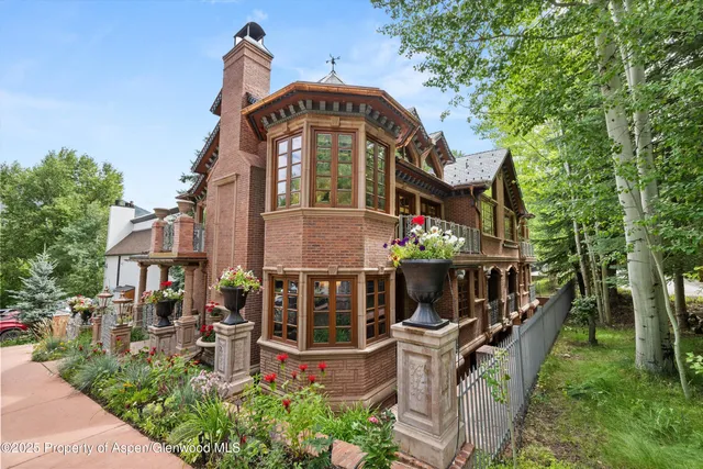 aerial view of a house with a yard