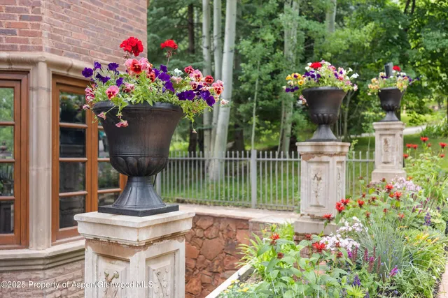 a front view of a house with fountain