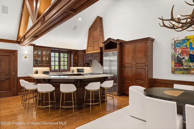 a dinning table and chairs in a room