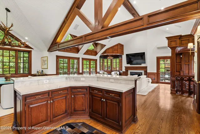 a kitchen with stainless steel appliances granite countertop a stove and a wooden cabinets