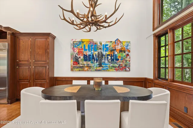 a view of a dining area with furniture and a window