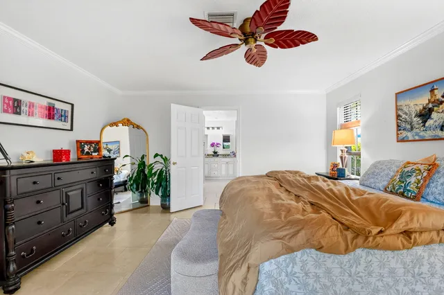 a bed room with a bed and a chandelier