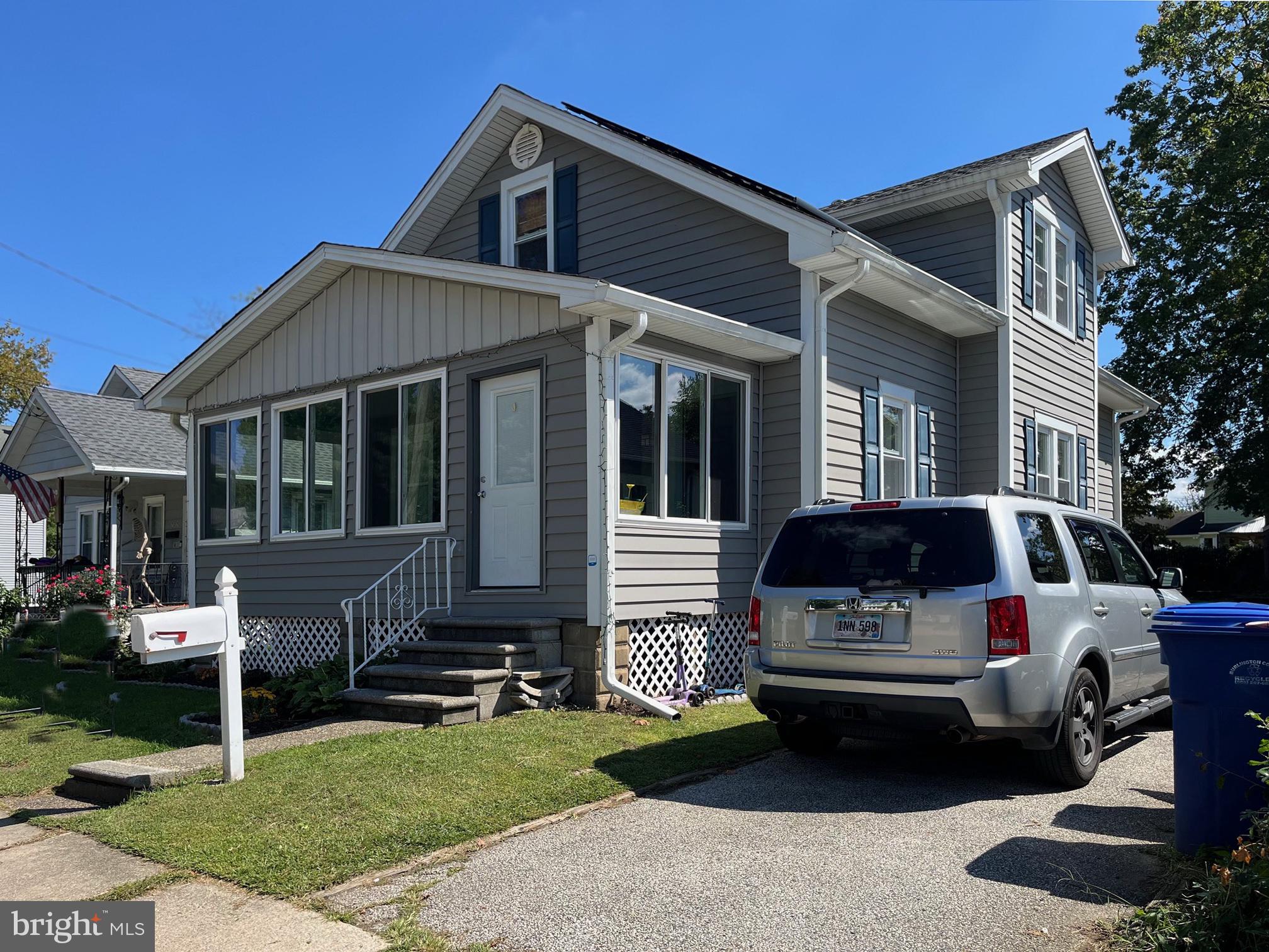 719 Hickory Street Delanco, NJ 08075 - Photo 4 of 29 a front view of a house with a garden