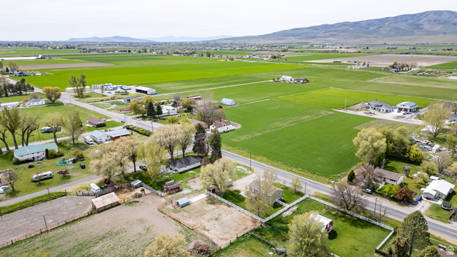 365 South Center Street Fielding, UT 84311 - Photo 36 of 41 Aerial overview of property's location featuring a mountain backdrop and nearby suburban area