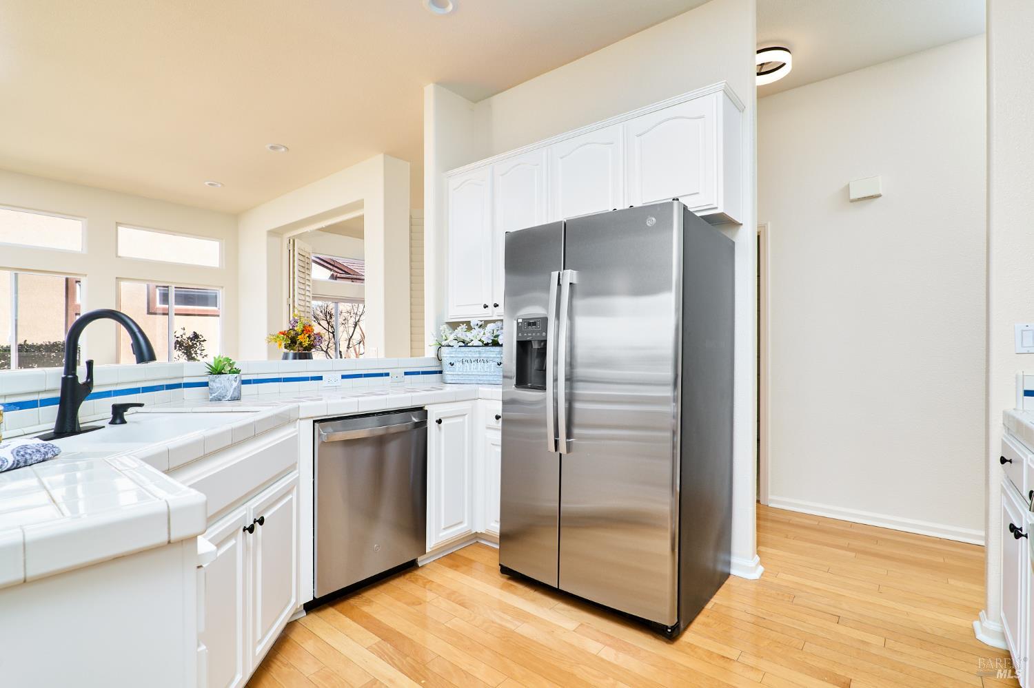 48 Augusta Court Rio Vista, CA 94571 - Photo 14 of 32 a kitchen with granite countertop a refrigerator and a sink