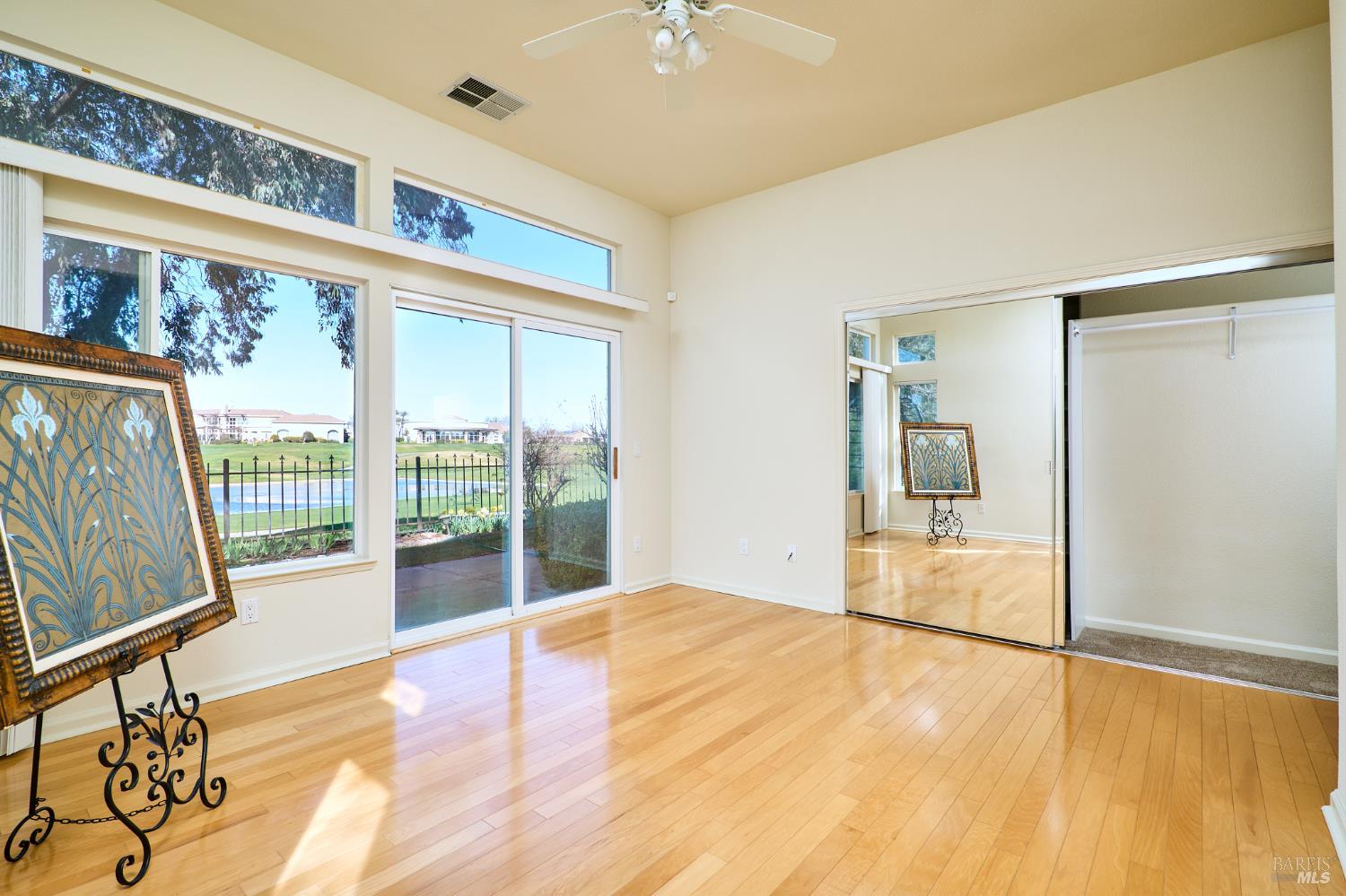 48 Augusta Court Rio Vista, CA 94571 - Photo 17 of 32 a view of an empty room with wooden floor and a window