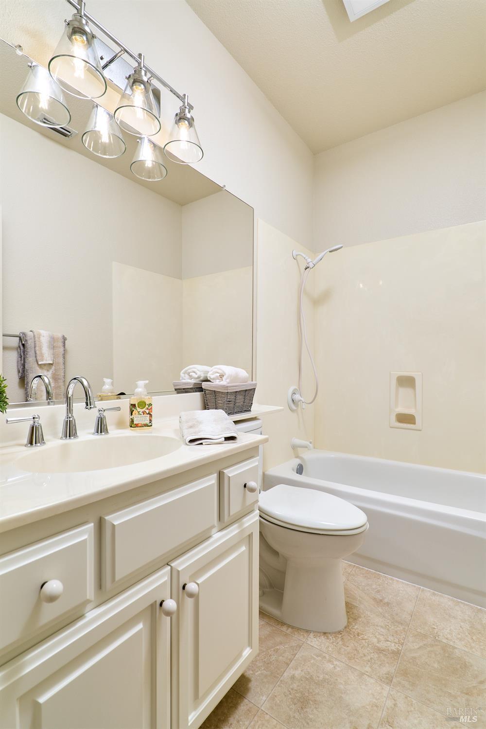 48 Augusta Court Rio Vista, CA 94571 - Photo 22 of 32 a bathroom with a double vanity sink mirror and toilet